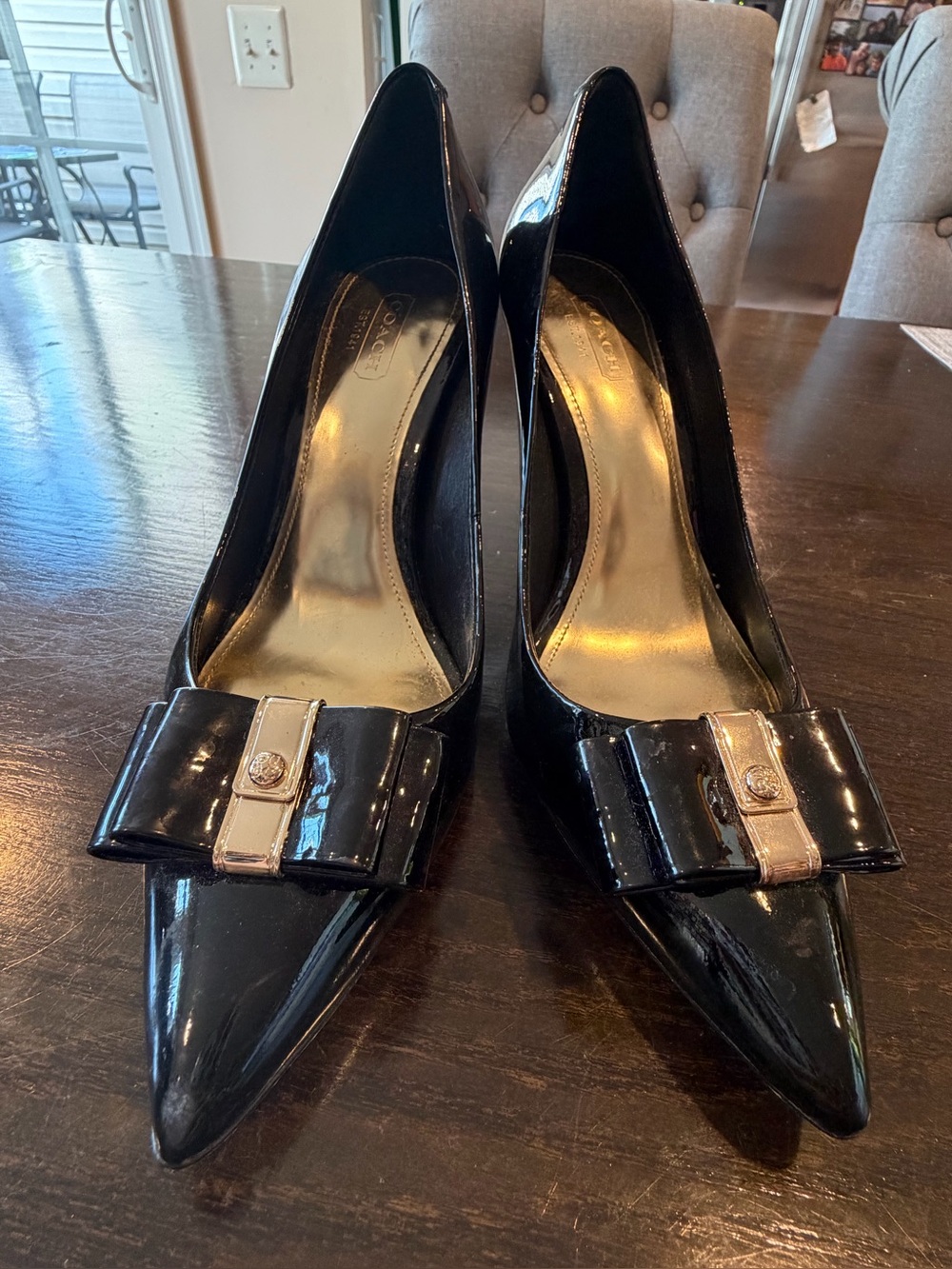 Coach Landrie Black Patent Pointed-Toe Pumps with Bow and Gold Accent